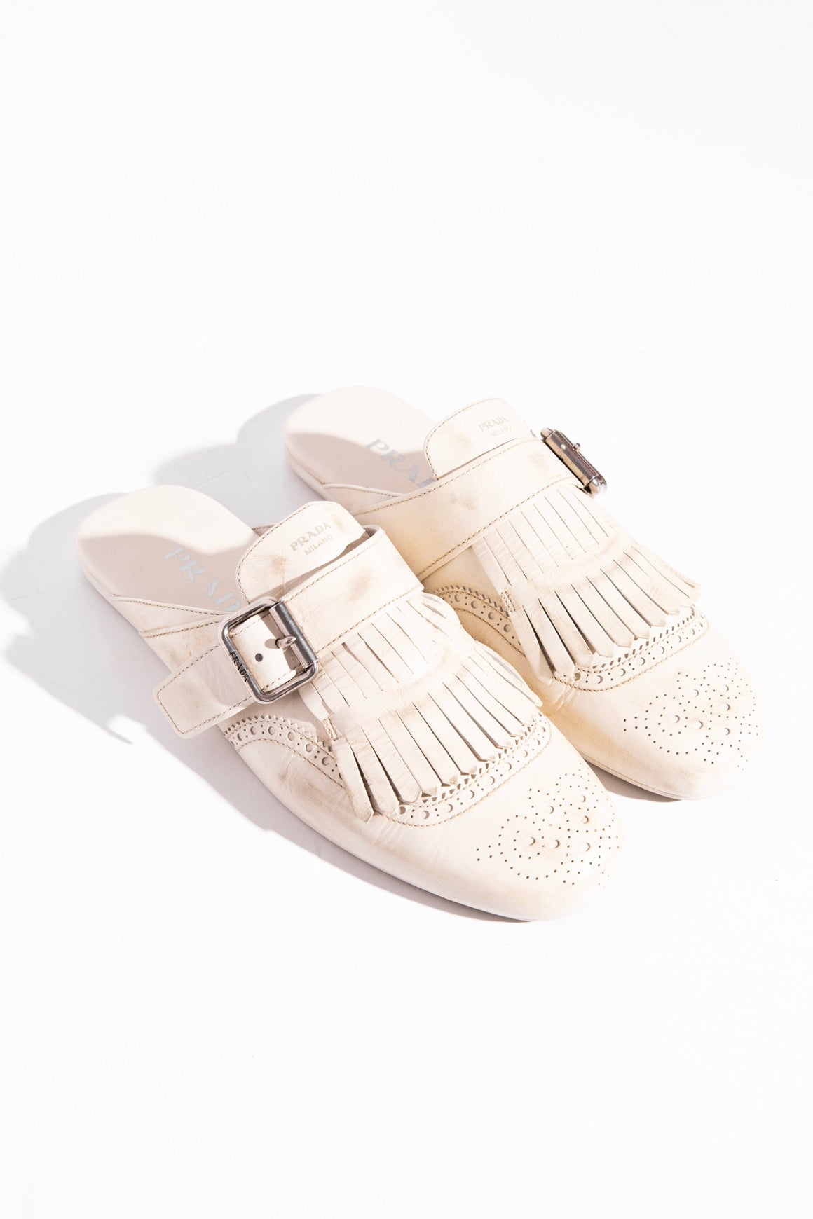 PRADA Cream Shuffle Fringed Kiltie Mule (Sz. 40)