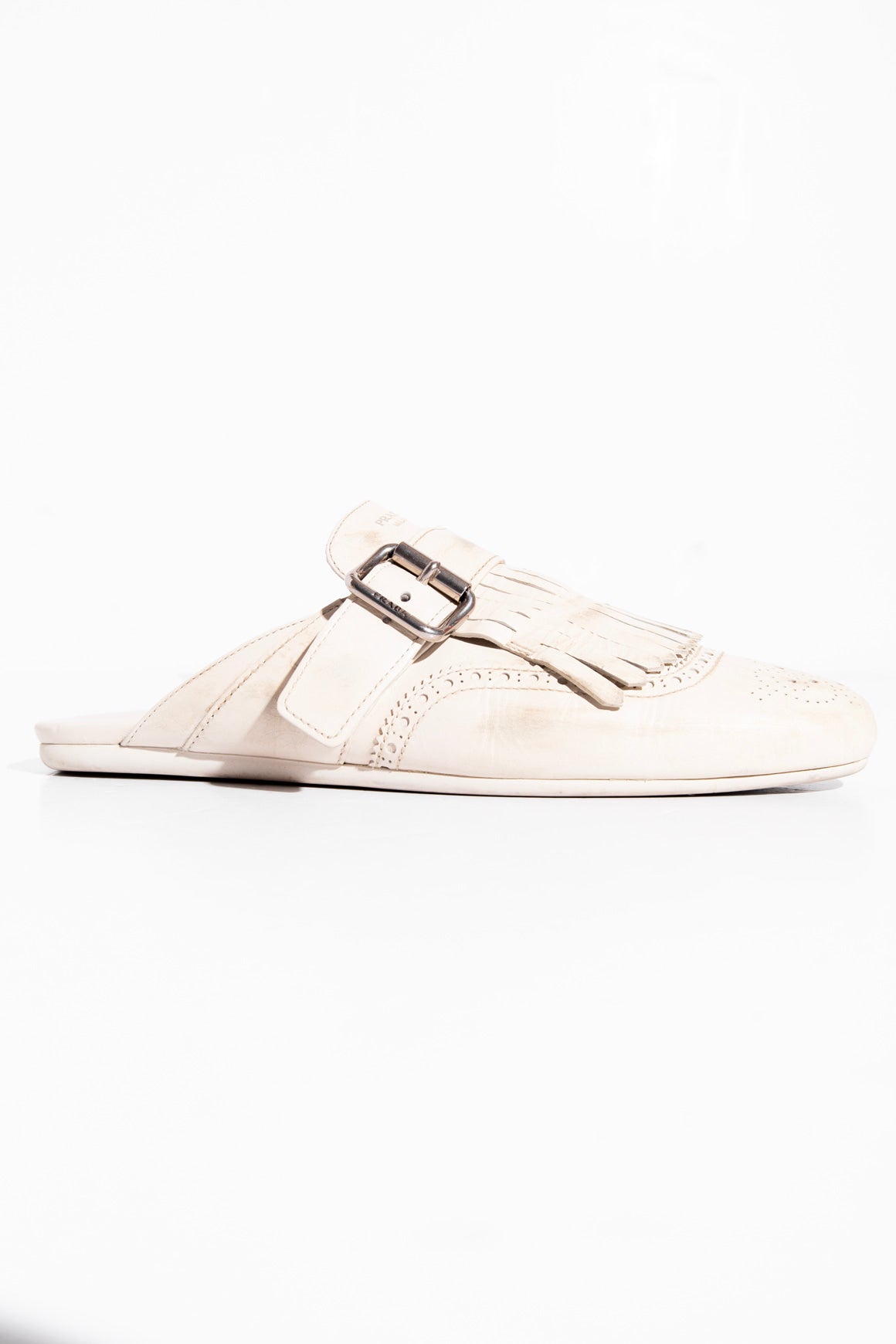 PRADA Cream Shuffle Fringed Kiltie Mule (Sz. 40)