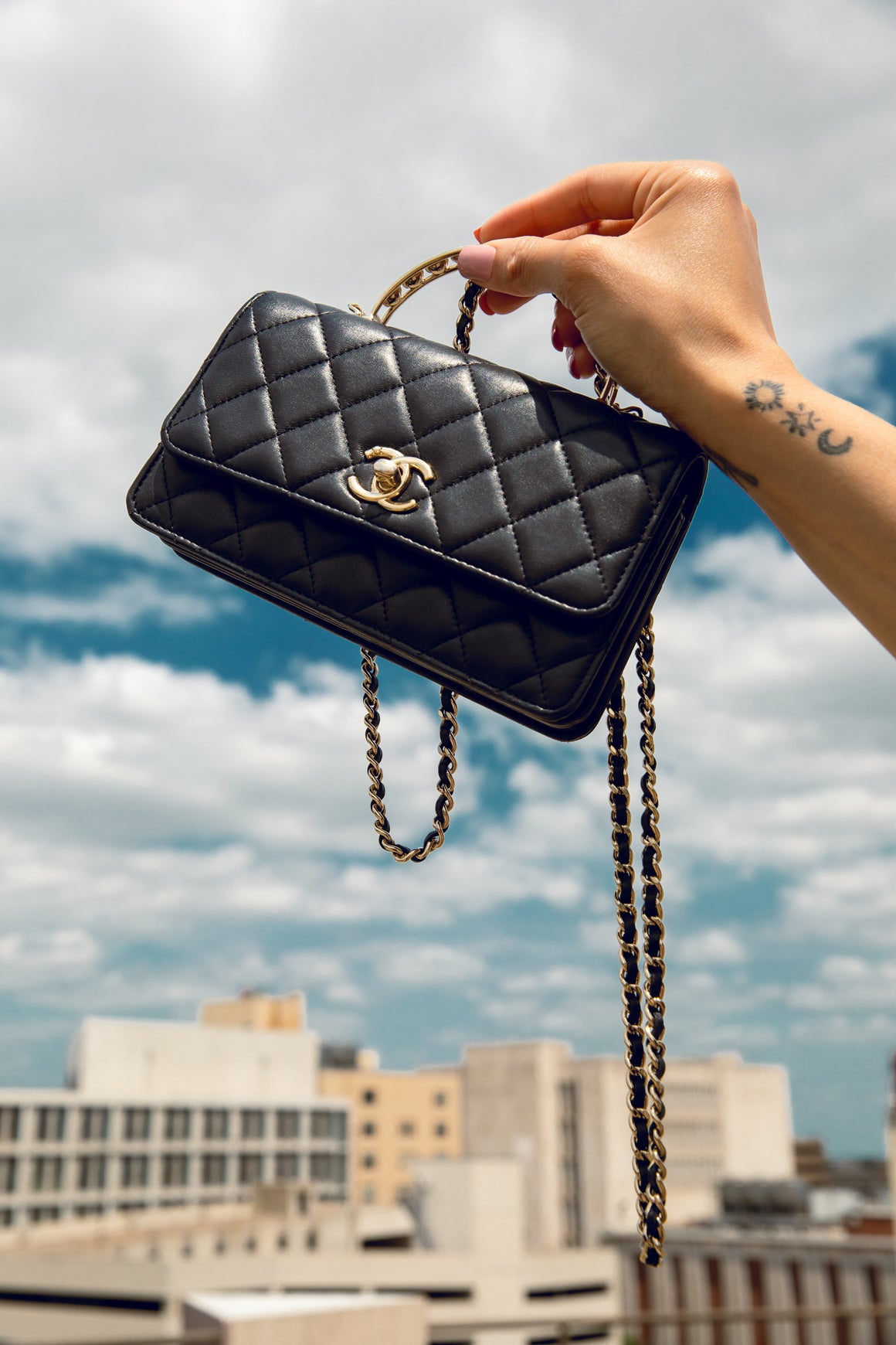 CHANEL Black Quilted Pearl Top Handle Wallet-on-Chain